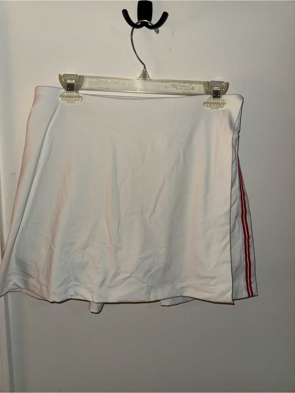 Women’s FLX High Rise Affirmation white skort with red trim detail